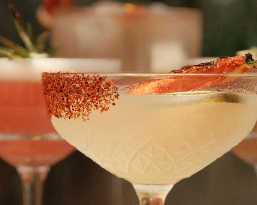 A selection of cocktails displayed on the bar at the New Yorker Hotel, highlighting the elegant setting and ambiance