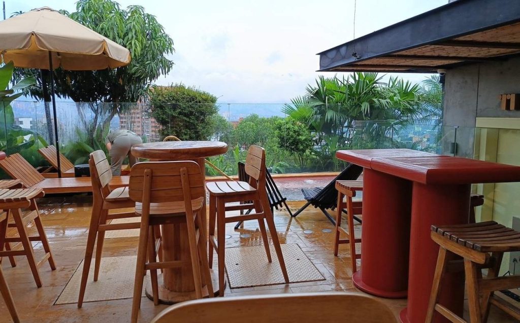 terrace 23hotel with wood tables and chairs, decorated with umbrellas colorful for you to enjoy outdoor