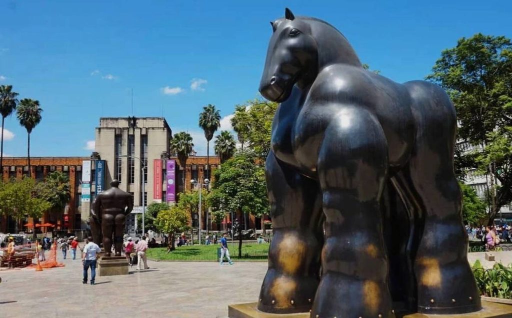 Big statue of a horse in front of a building, part of the cultural experiences in the center of Medellin